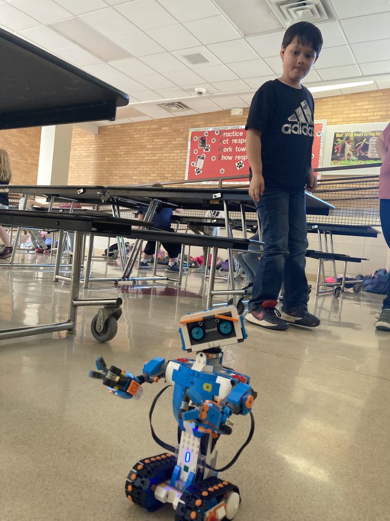 students play with robots