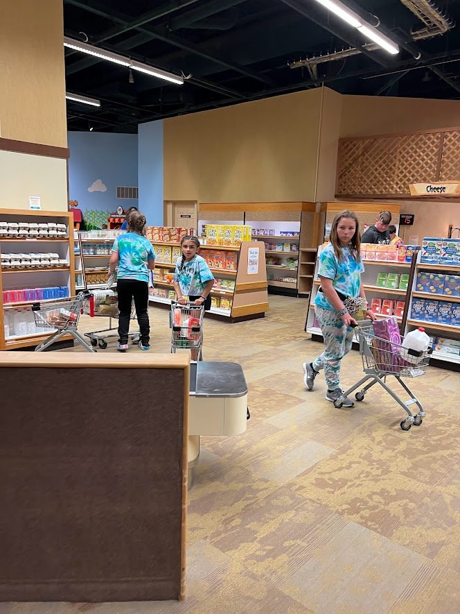 students shopping at mini grocery store