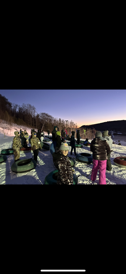 students gather during snow tubing