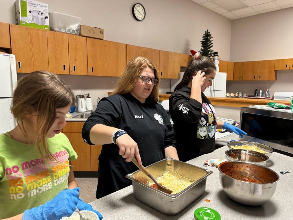students prepare community meal
